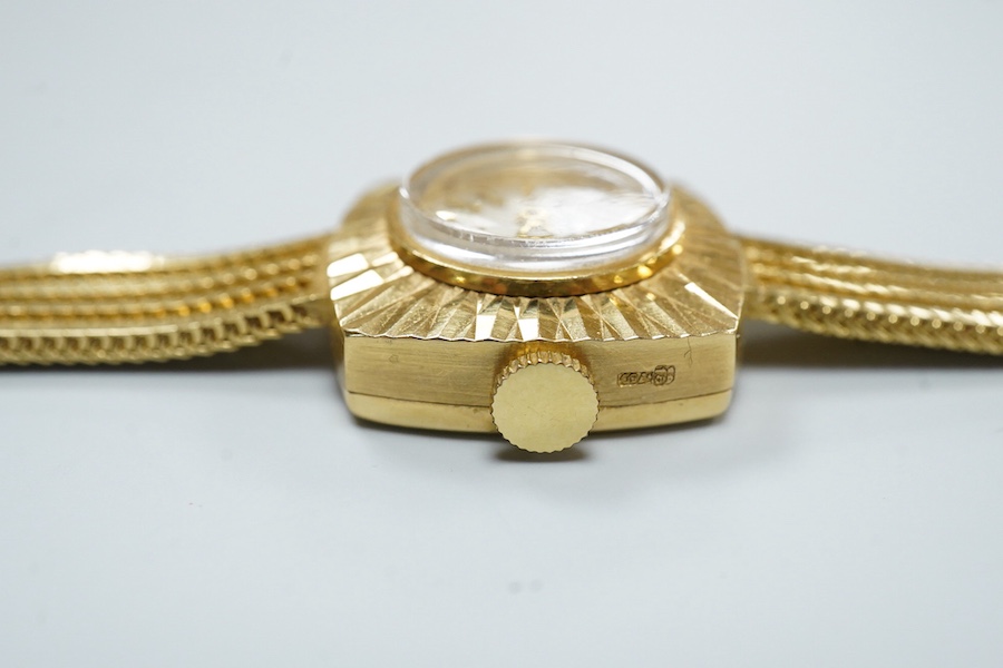 A lady's modern 18ct gold Cortebert manual wind wrist watch, with baton numerals, on 18ct gold integral strap, case diameter 18mm, overall length 17.7cm, gross weight 22 grams.